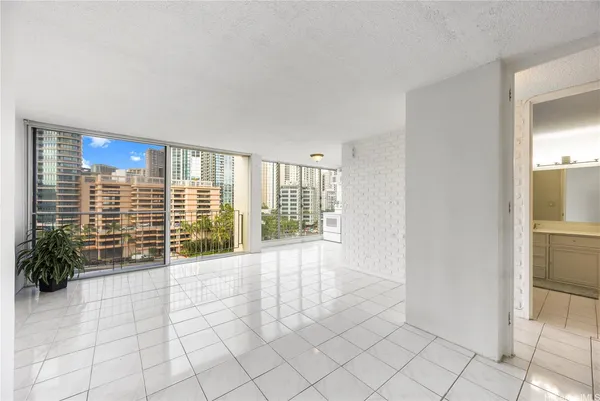 a view of an empty room with glass door and glass door