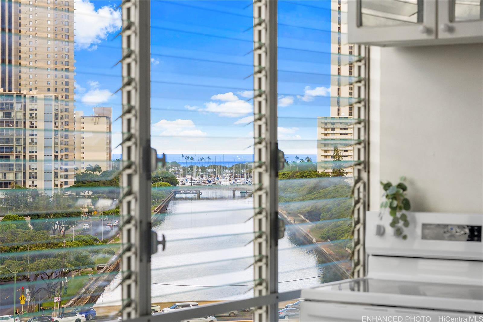 620 McCully Street, Unit 902 Honolulu, HI 96826 - Photo 13 of 23 a city view with tall buildings