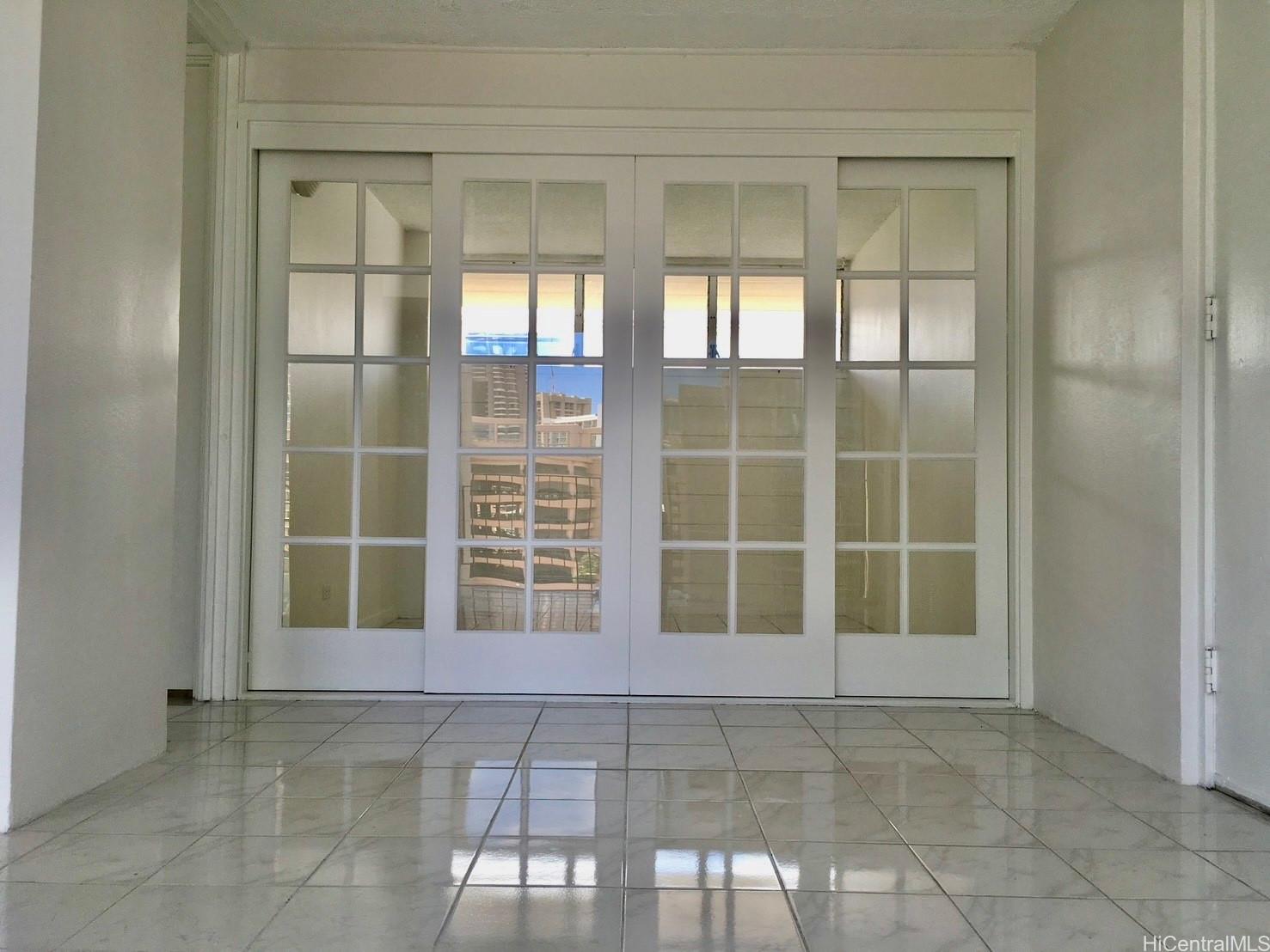 620 McCully Street, Unit 902 Honolulu, HI 96826 - Photo 3 of 14 a view of an empty room with a window