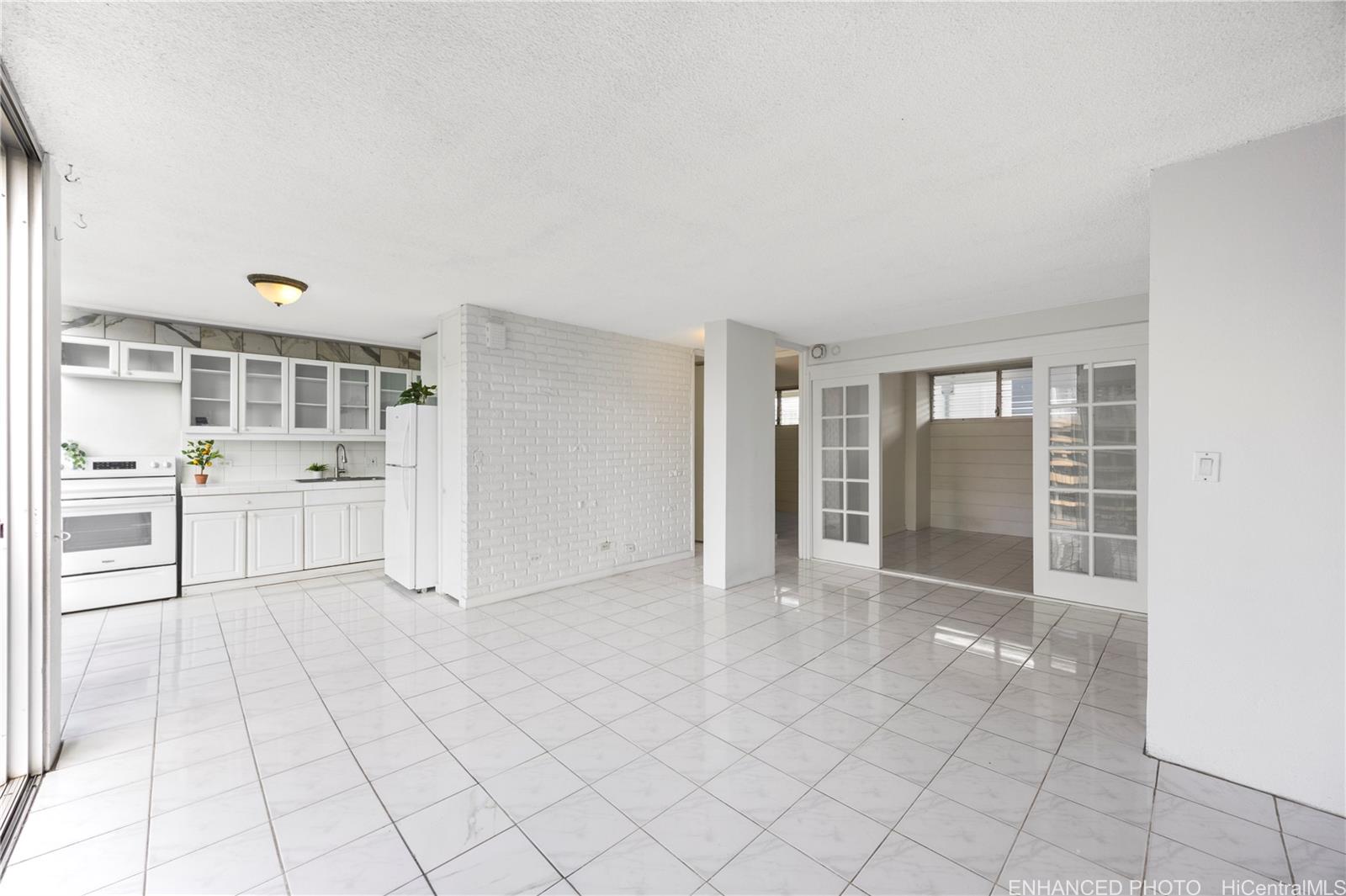 620 McCully Street, Unit 902 Honolulu, HI 96826 - Photo 4 of 23 a view of a kitchen with furniture and an entryway