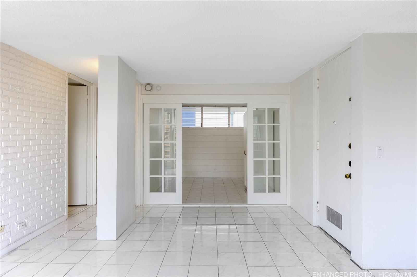 620 McCully Street, Unit 902 Honolulu, HI 96826 - Photo 7 of 23 an empty room with windows