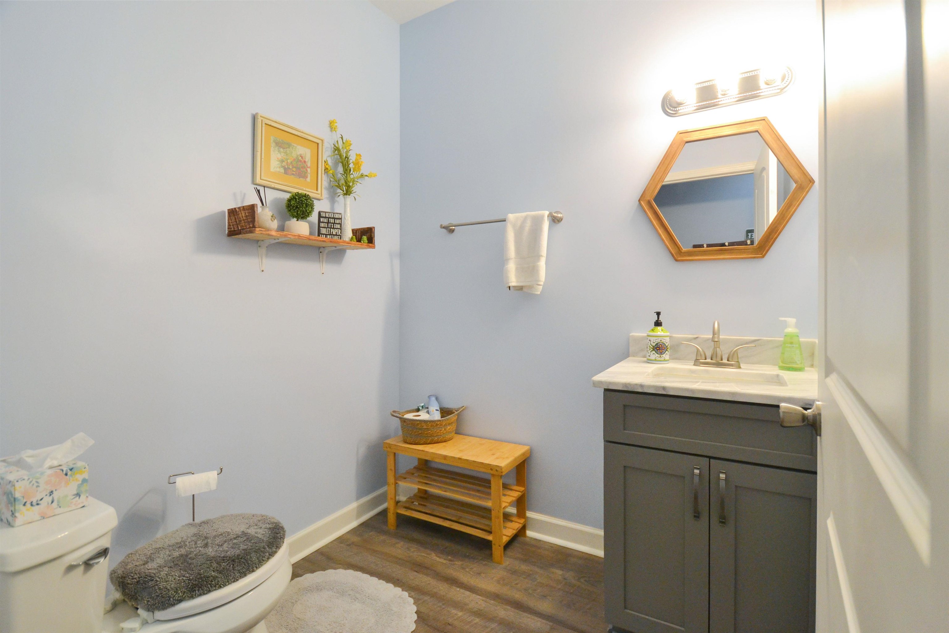 425 Honeysuckle Road Moscow, TN 38057 - Photo 15 of 25 a bathroom with a toilet sink and mirror