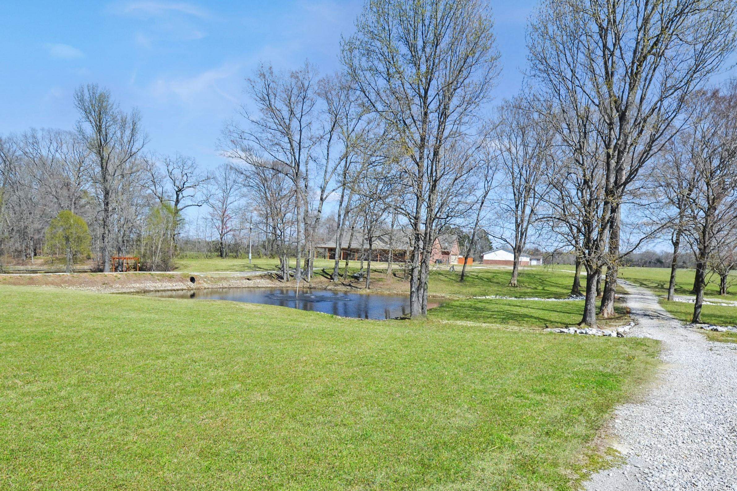425 Honeysuckle Road Moscow, TN 38057 - Photo 3 of 25 a view of swimming pool with trees and green space