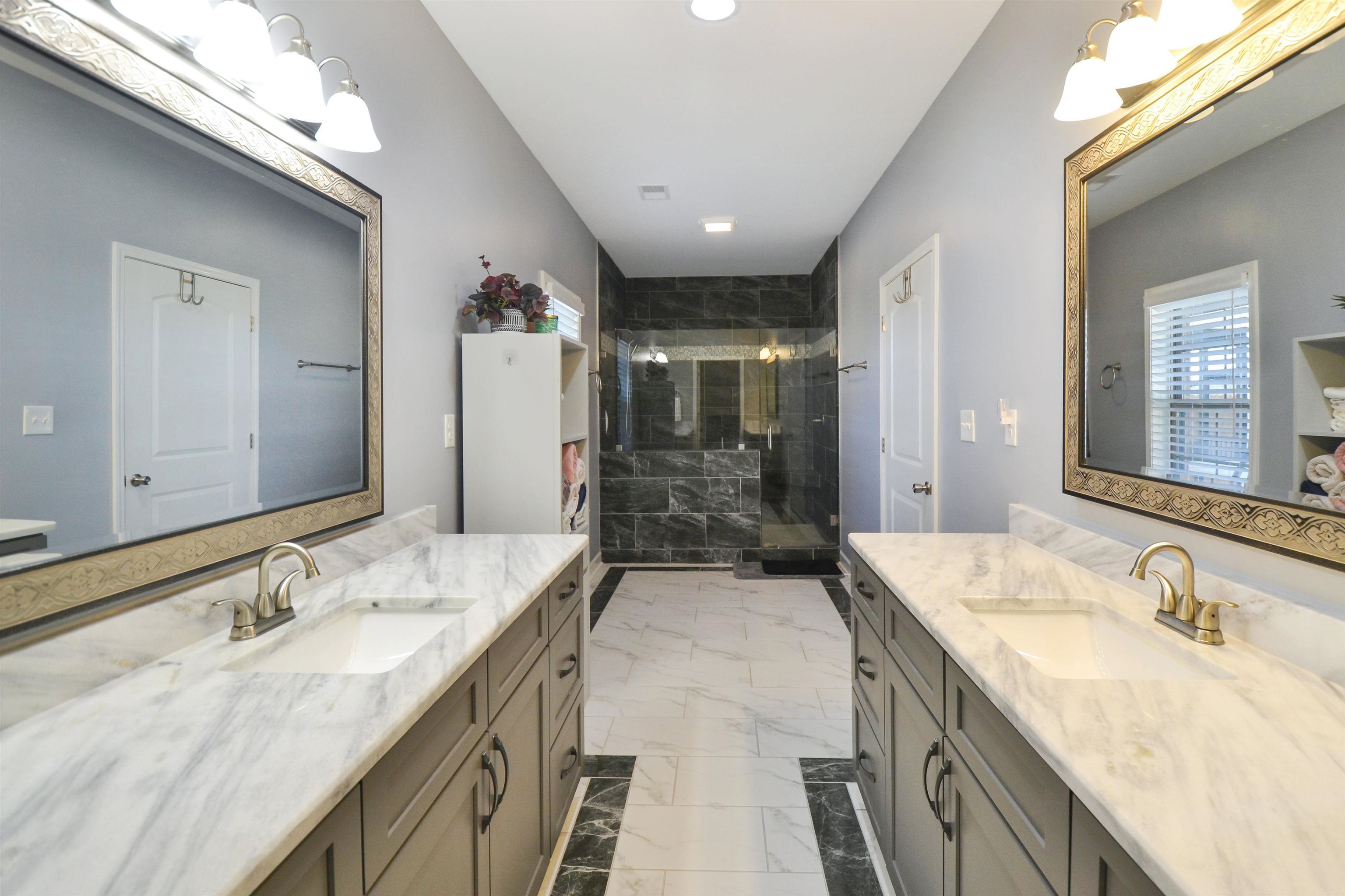425 Honeysuckle Road Moscow, TN 38057 - Photo 9 of 25 a bathroom with a granite countertop sink mirror and double