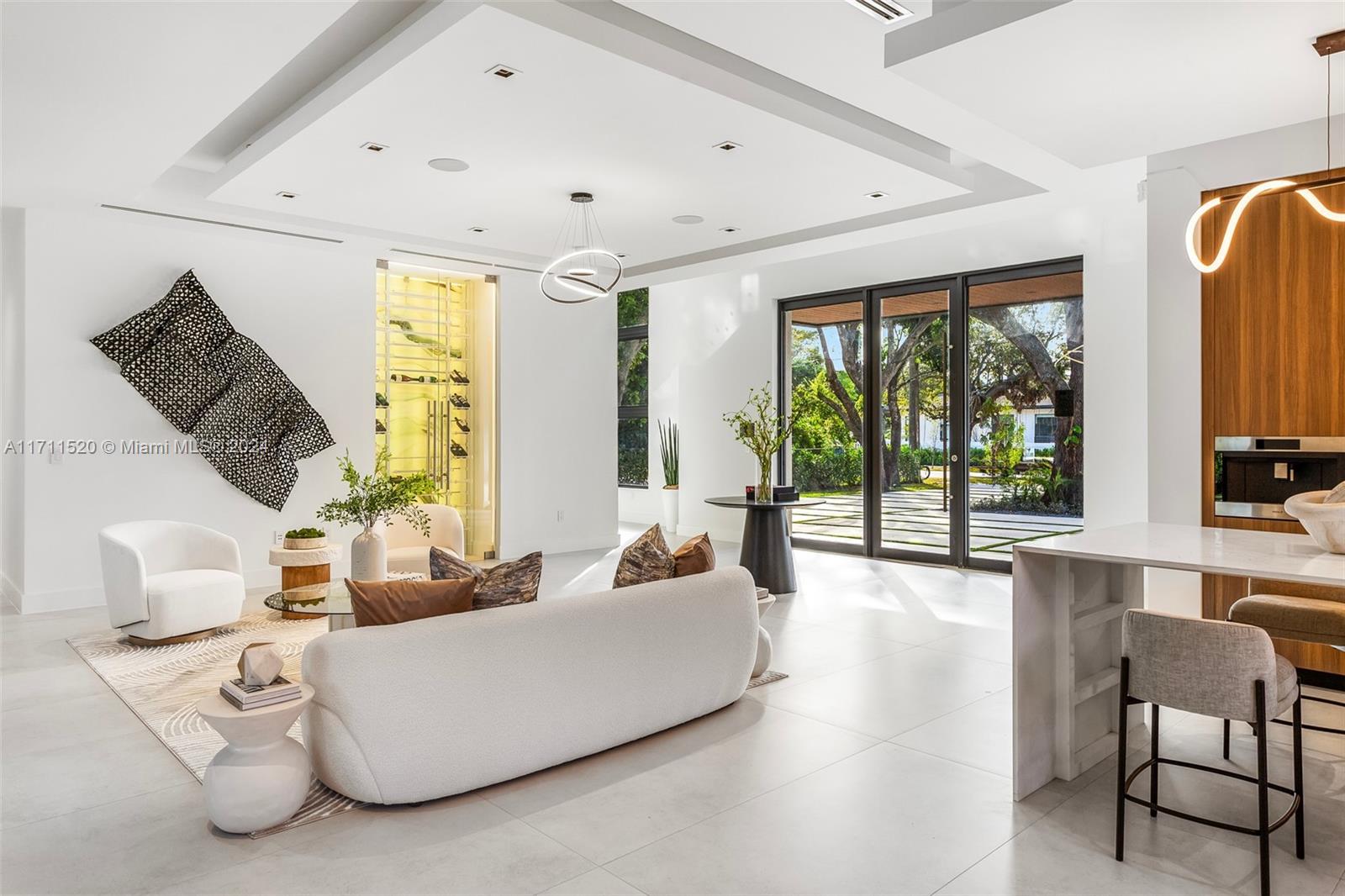 7635 Southwest 72nd Avenue Miami, FL 33143 - Photo 14 of 75 a living room with furniture and large windows