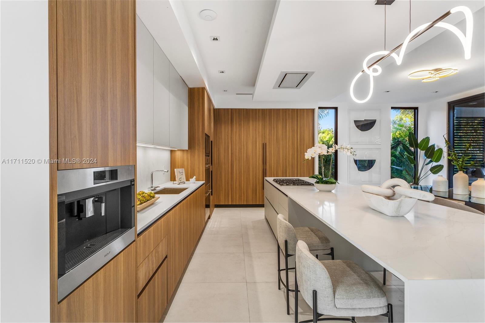 7635 Southwest 72nd Avenue Miami, FL 33143 - Photo 20 of 75 a large white kitchen with a large window
