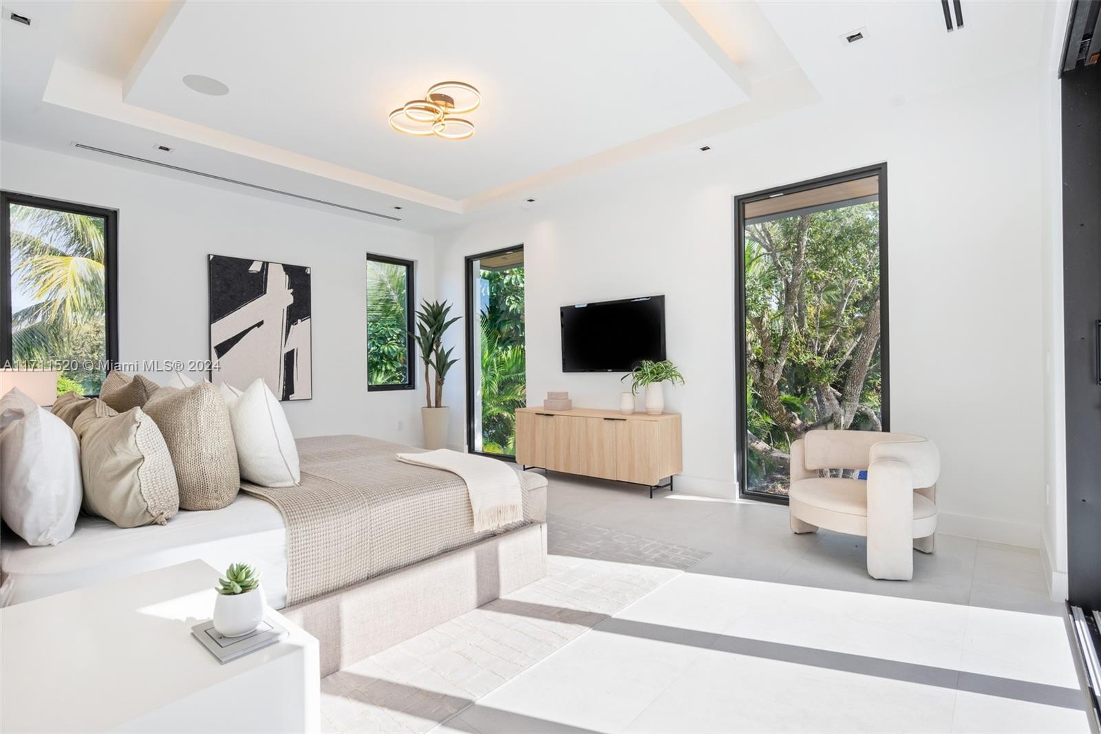 7635 Southwest 72nd Avenue Miami, FL 33143 - Photo 43 of 75 a bedroom with a bed and a flat screen tv