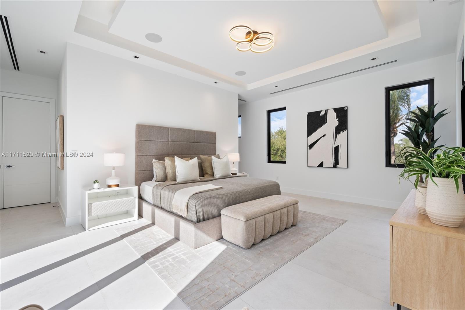7635 Southwest 72nd Avenue Miami, FL 33143 - Photo 44 of 75 a bed room with bed and a potted plant