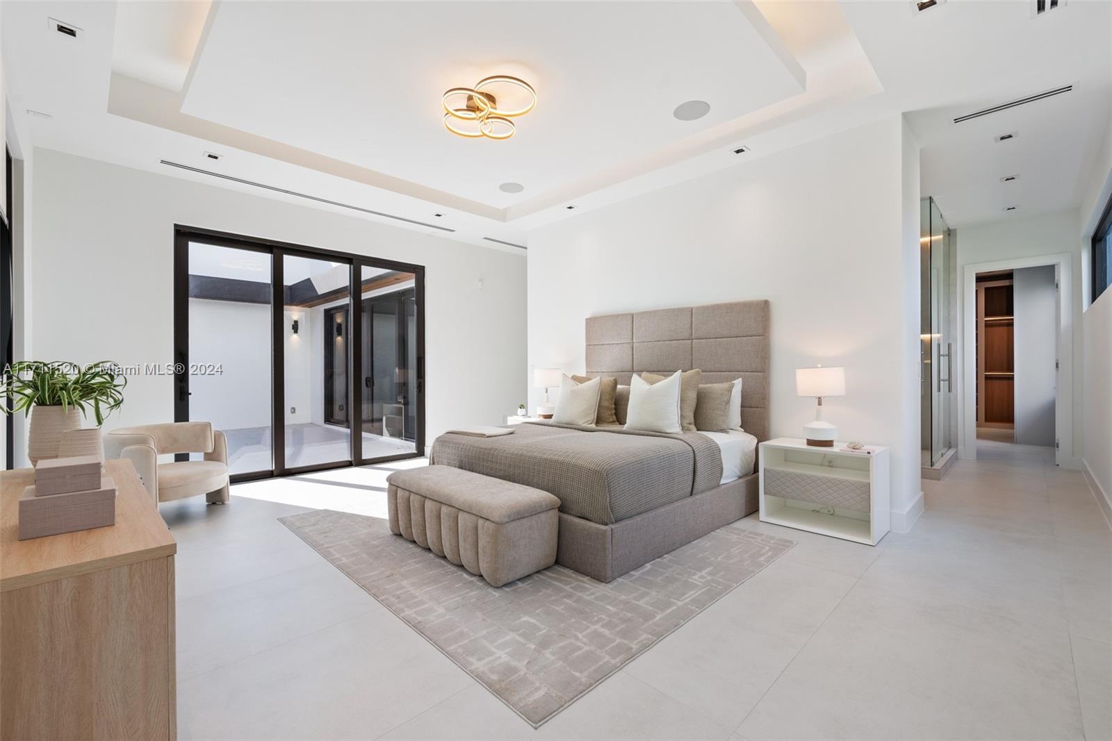 7635 Southwest 72nd Avenue Miami, FL 33143 - Photo 45 of 75 a spacious bedroom with a bed and window