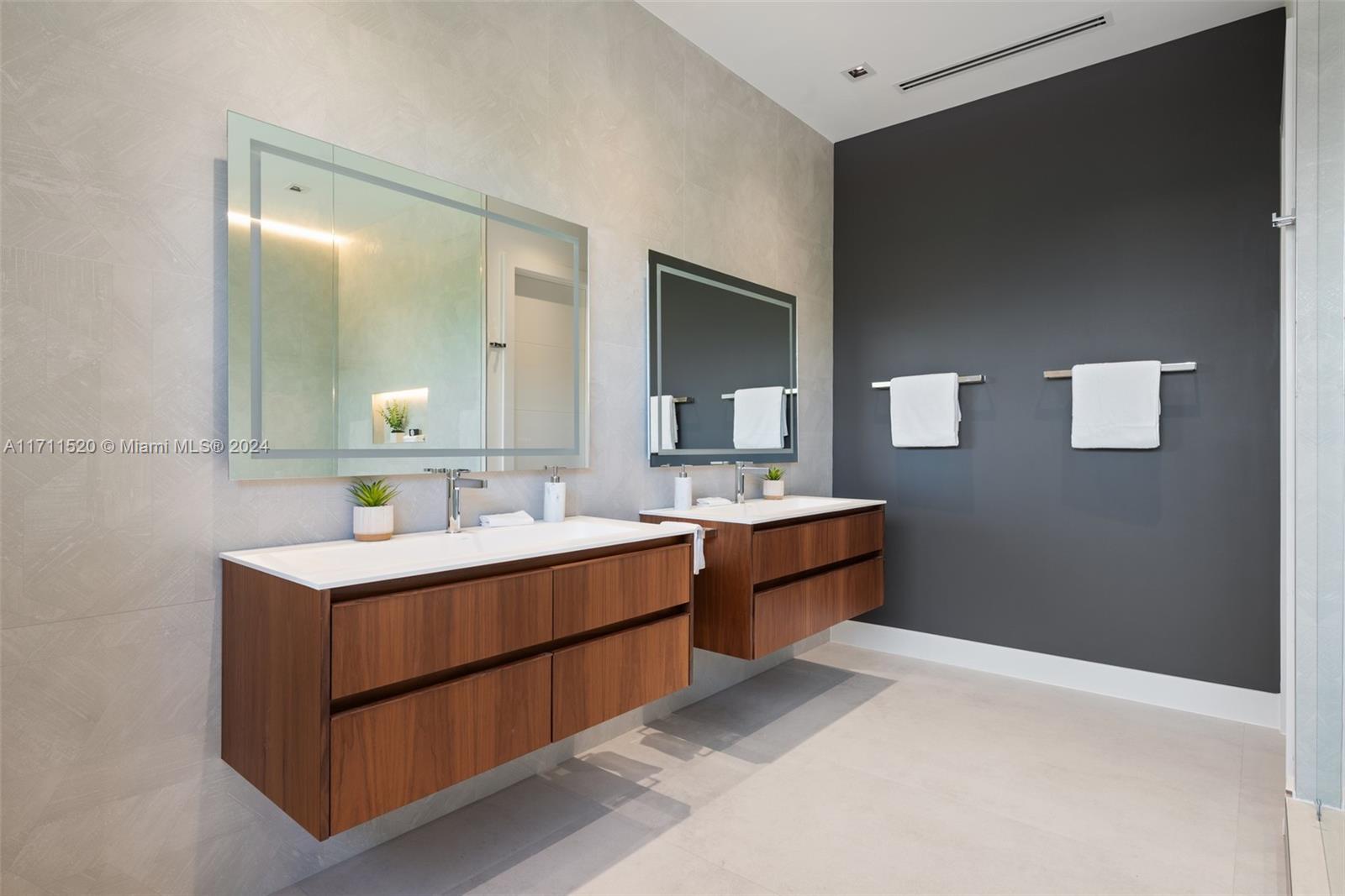 7635 Southwest 72nd Avenue Miami, FL 33143 - Photo 46 of 75 a bathroom with a sink and a mirror