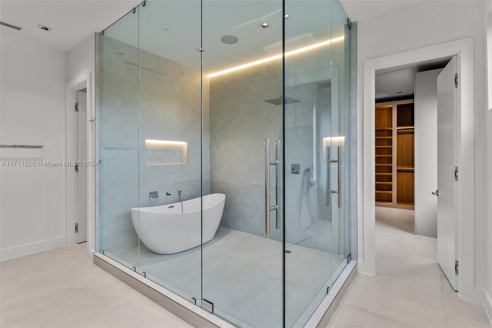 7635 Southwest 72nd Avenue Miami, FL 33143 - Photo 47 of 75 a bathroom with a tub and shower