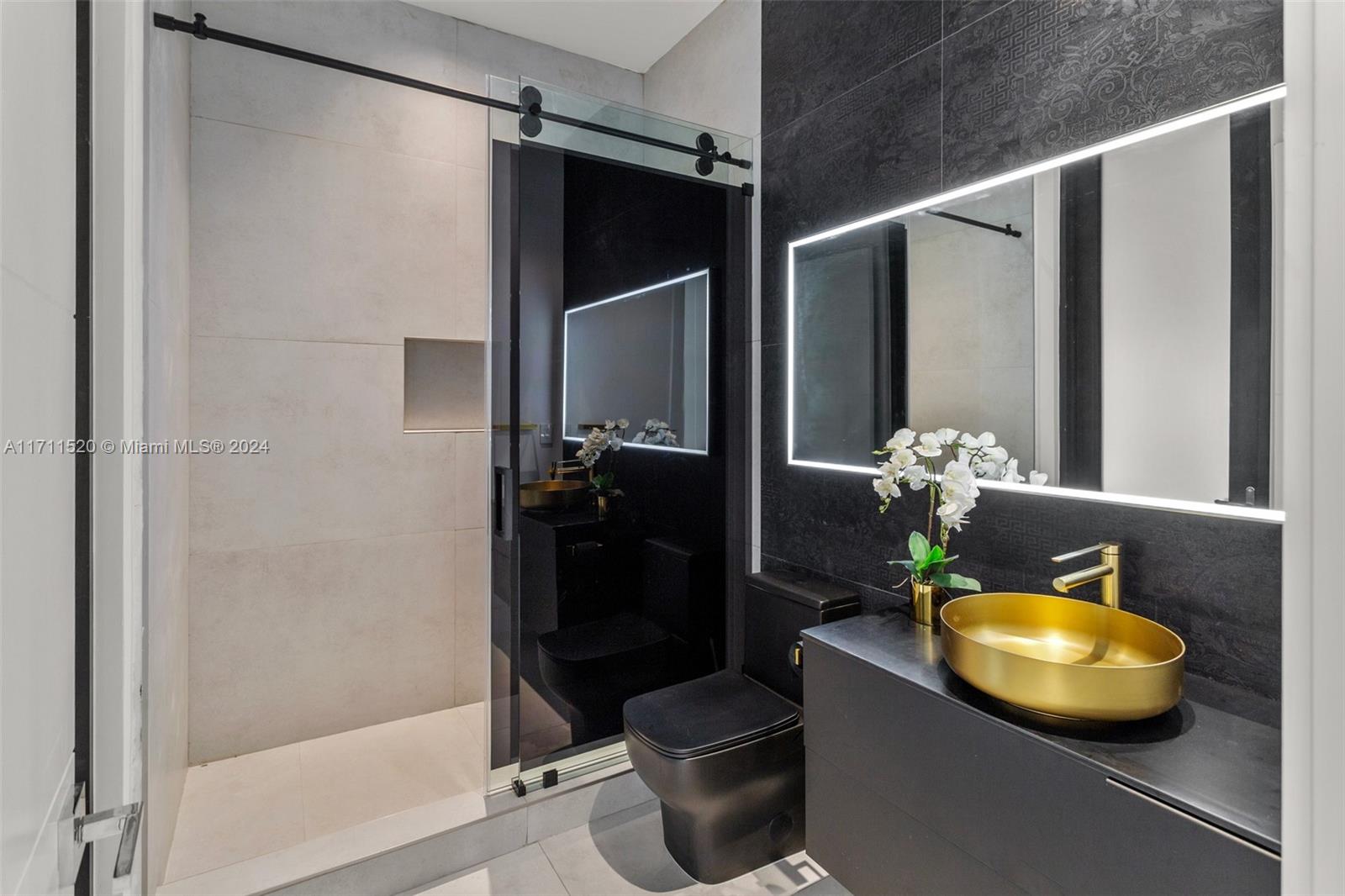 7635 Southwest 72nd Avenue Miami, FL 33143 - Photo 55 of 75 a bathroom with a sink toilet and shower