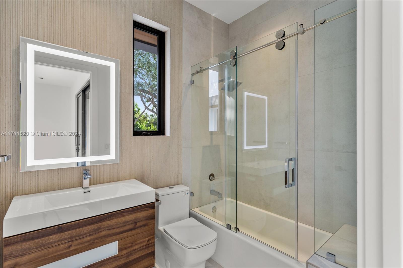 7635 Southwest 72nd Avenue Miami, FL 33143 - Photo 57 of 75 a bathroom with a sink toilet and shower