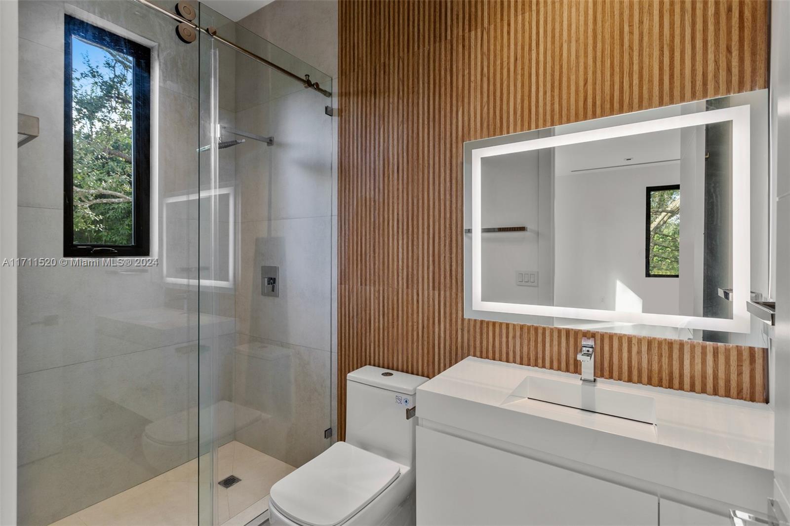 7635 Southwest 72nd Avenue Miami, FL 33143 - Photo 61 of 75 a bathroom with a sink a toilet and shower