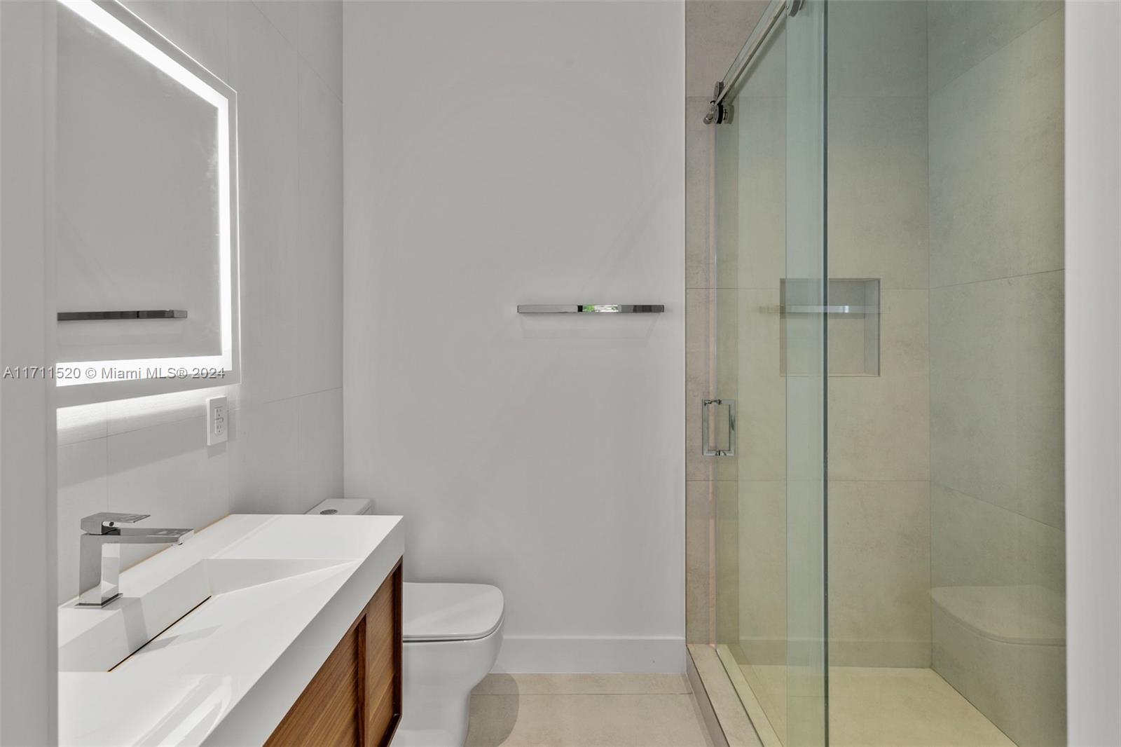 7635 Southwest 72nd Avenue Miami, FL 33143 - Photo 65 of 75 a bathroom with a sink a toilet and shower