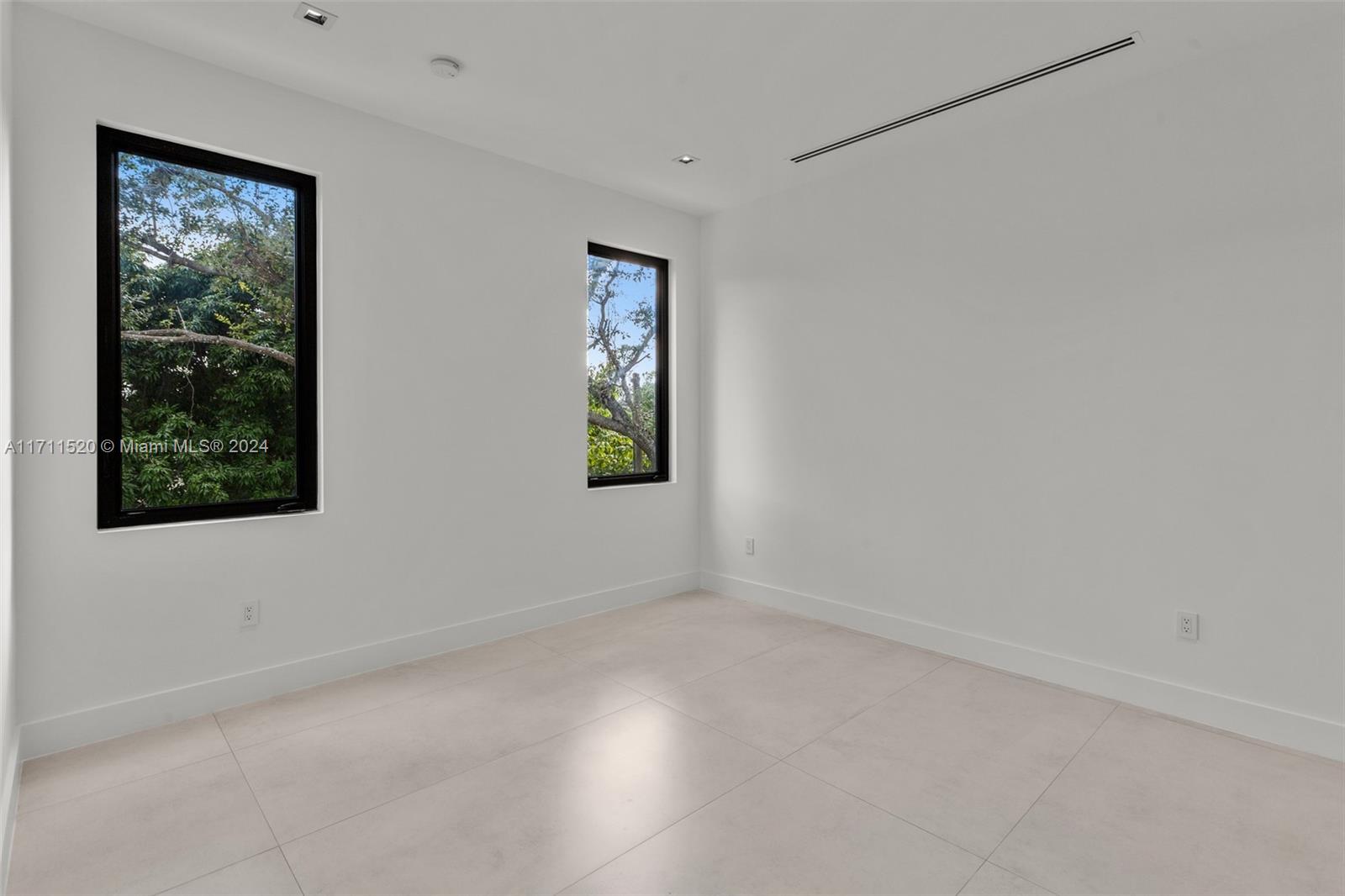 7635 Southwest 72nd Avenue Miami, FL 33143 - Photo 66 of 75 an empty room with windows