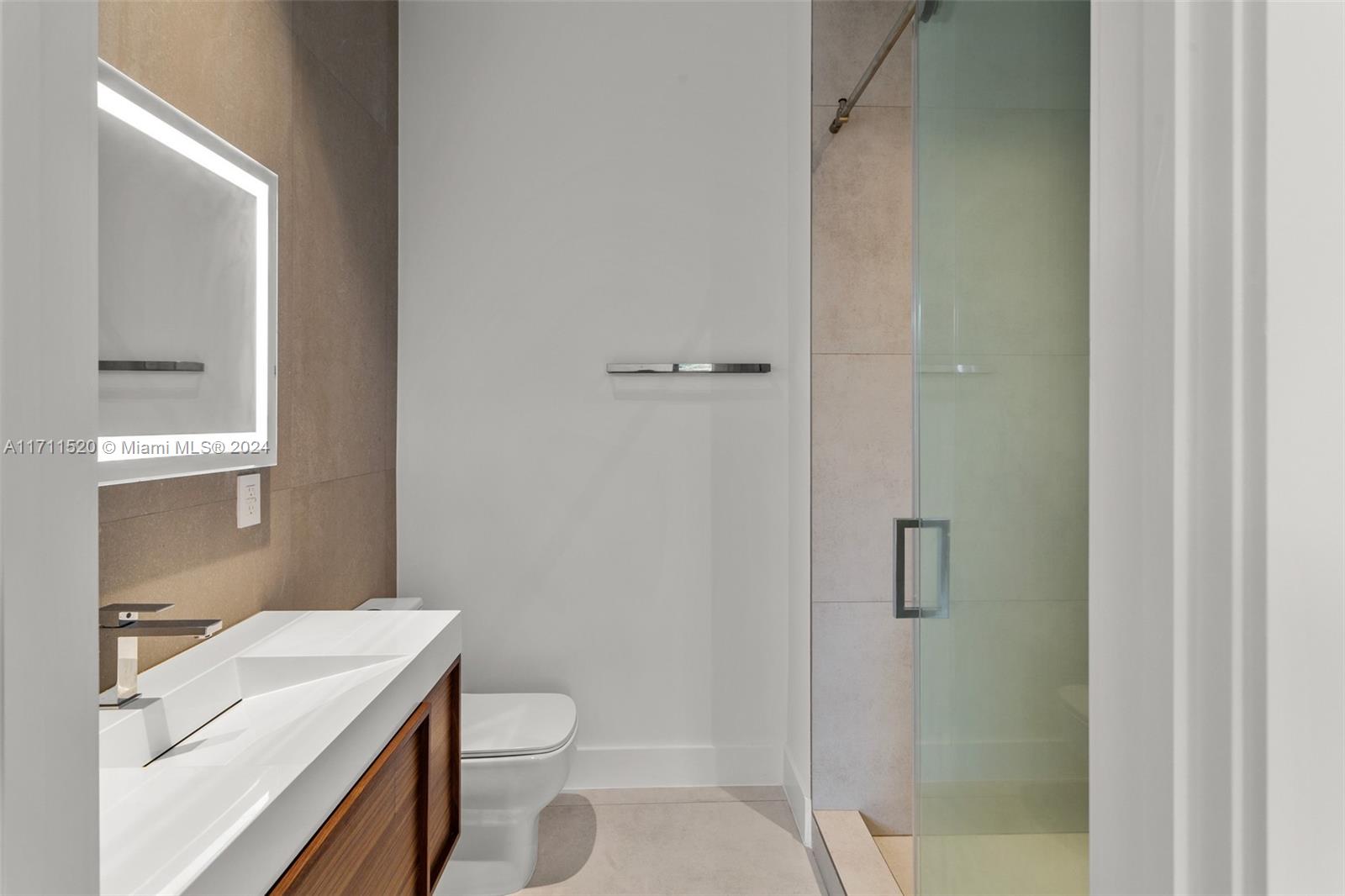 7635 Southwest 72nd Avenue Miami, FL 33143 - Photo 67 of 75 a bathroom with a sink a toilet and shower