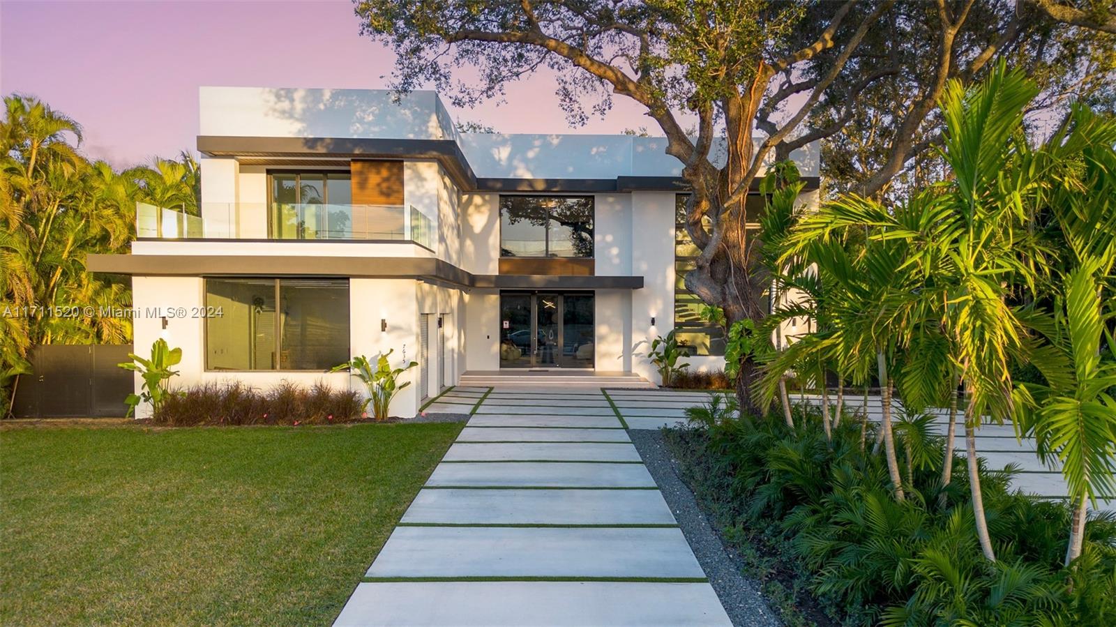 7635 Southwest 72nd Avenue Miami, FL 33143 - Photo 71 of 75 a front view of a house with garden