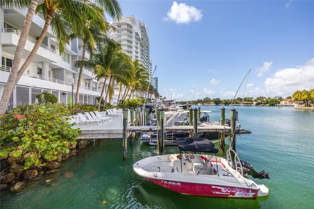a swimming pool with outdoor seating and yard