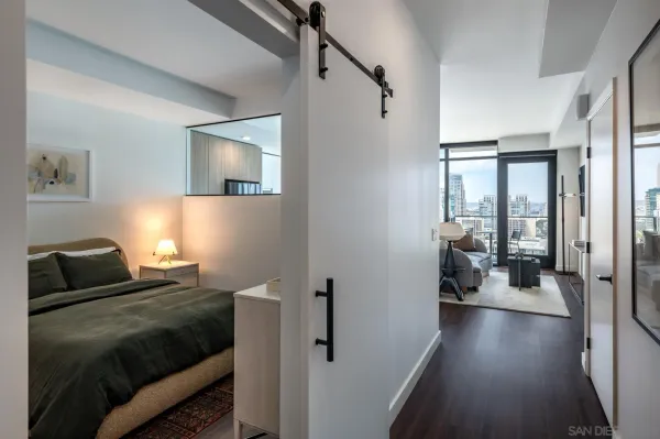 a bedroom with a bed and a couch