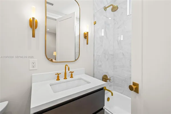 a bedroom with a bed and a table