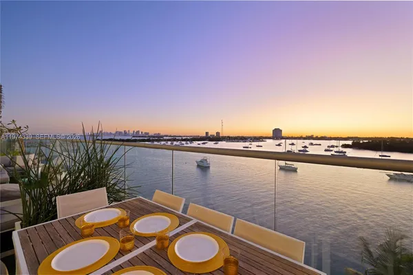 a view of a lake with furniture