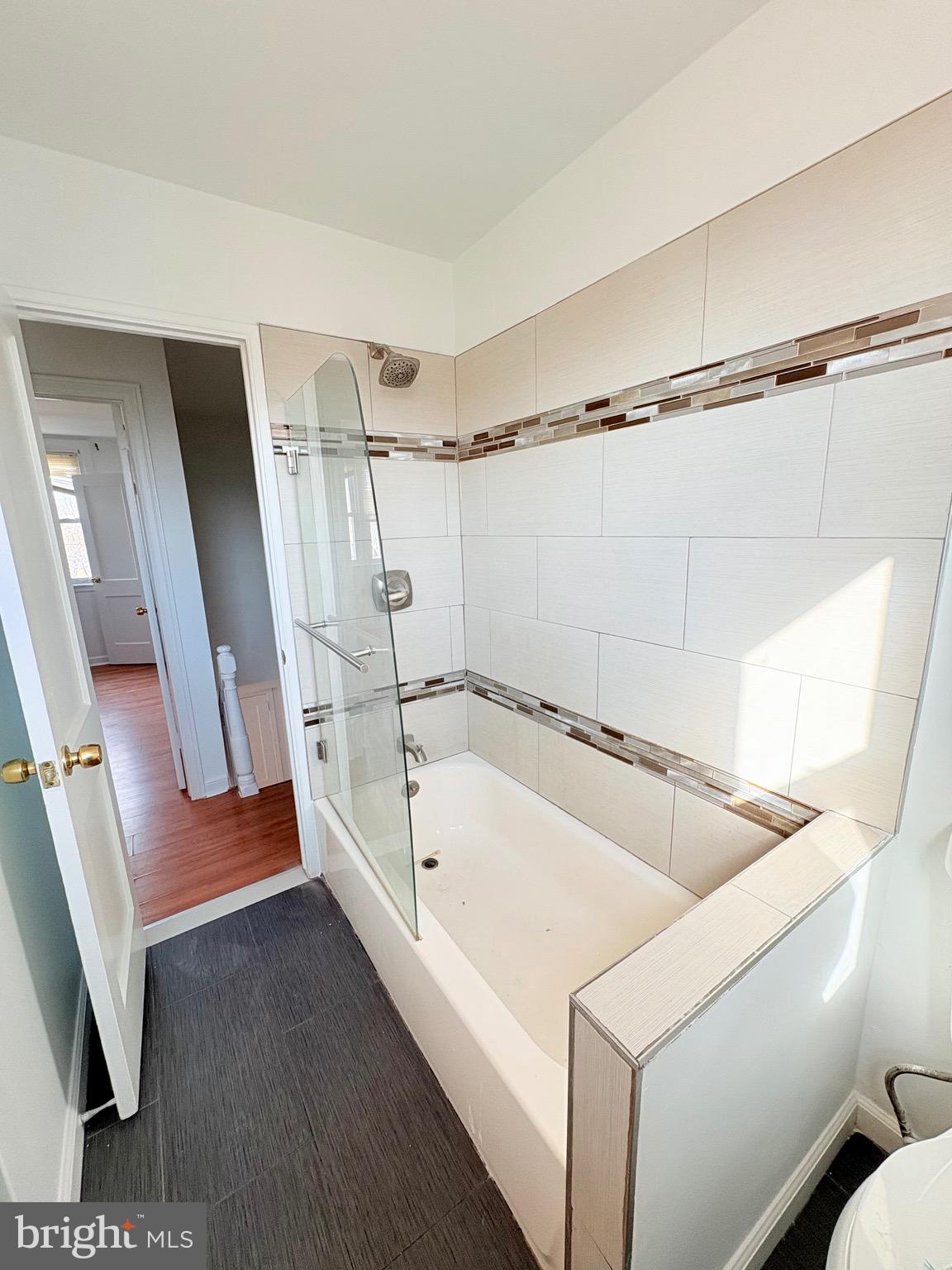 6045 Summerdale Avenue Philadelphia, PA 19149 - Photo 11 of 12 a bathroom with a tub a sink and a shower