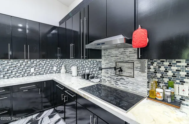 a kitchen with a sink and a stove