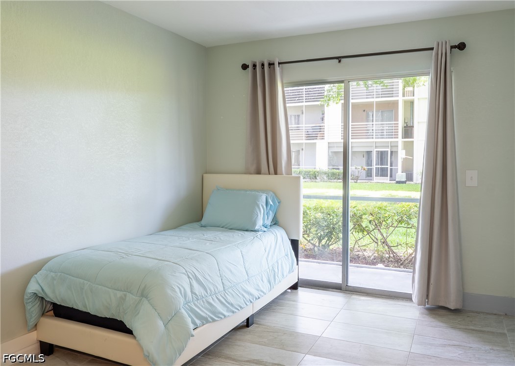 592 Fanshaw Way, Unit O Boca Raton, FL 33434 - Photo 14 of 25 a bedroom with a bed and a window