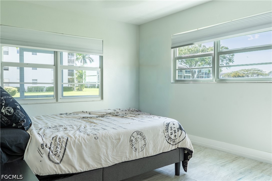 592 Fanshaw Way, Unit O Boca Raton, FL 33434 - Photo 7 of 25 a bedroom with a bed and a window