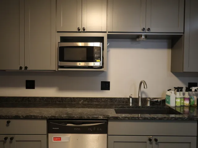 a kitchen with appliances cabinets and a counter top