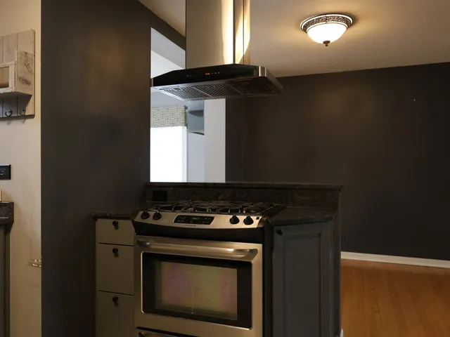 a kitchen with a stove and a microwave