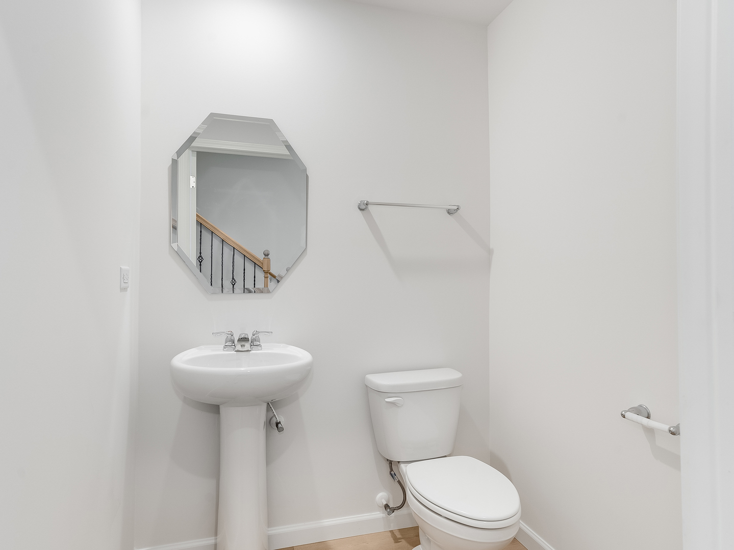 660 Switchgrass Way, Unit 58002 Bolingbrook, IL 60490 - Photo 13 of 24 a bathroom with a sink toilet and a mirror