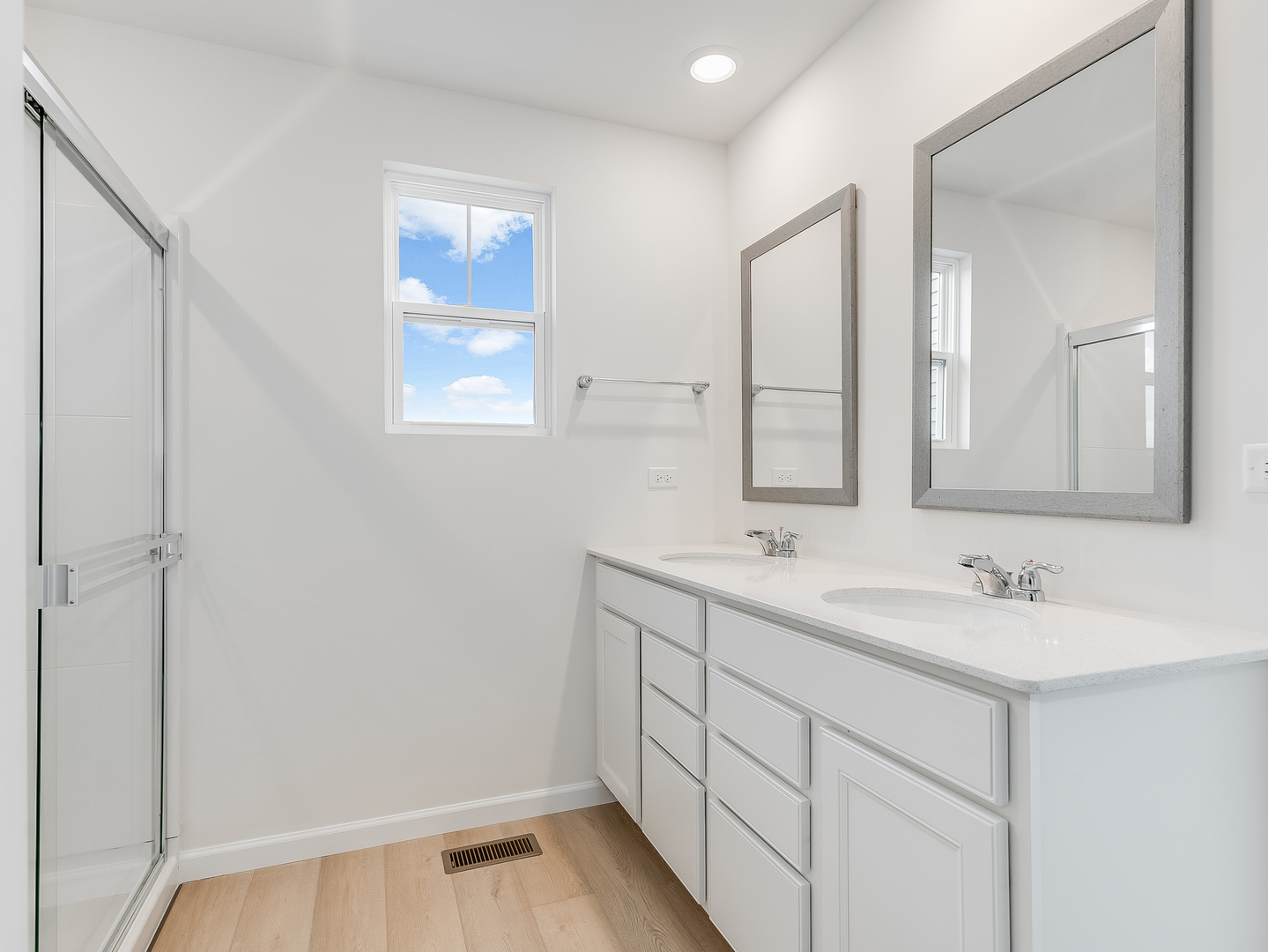 660 Switchgrass Way, Unit 58002 Bolingbrook, IL 60490 - Photo 15 of 24 a bathroom with 2 sink and a mirror