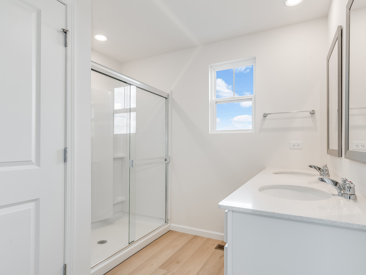 660 Switchgrass Way, Unit 58002 Bolingbrook, IL 60490 - Photo 16 of 24 a bathroom with a shower sink and mirror