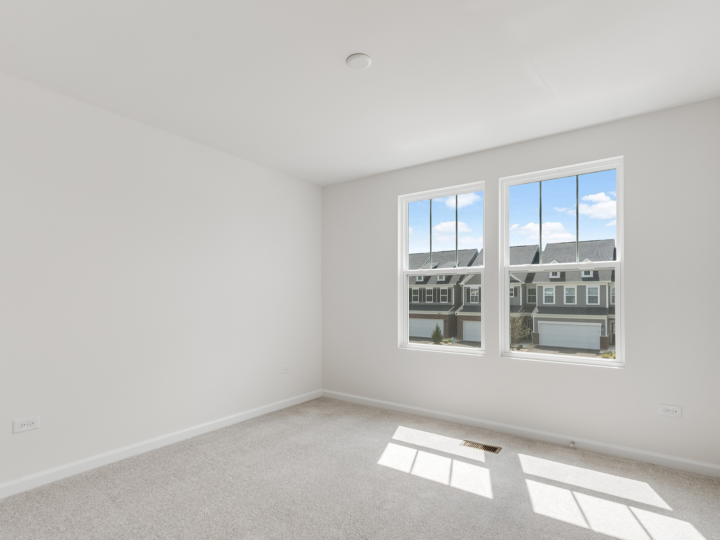 660 Switchgrass Way, Unit 58002 Bolingbrook, IL 60490 - Photo 18 of 24 an empty room with windows
