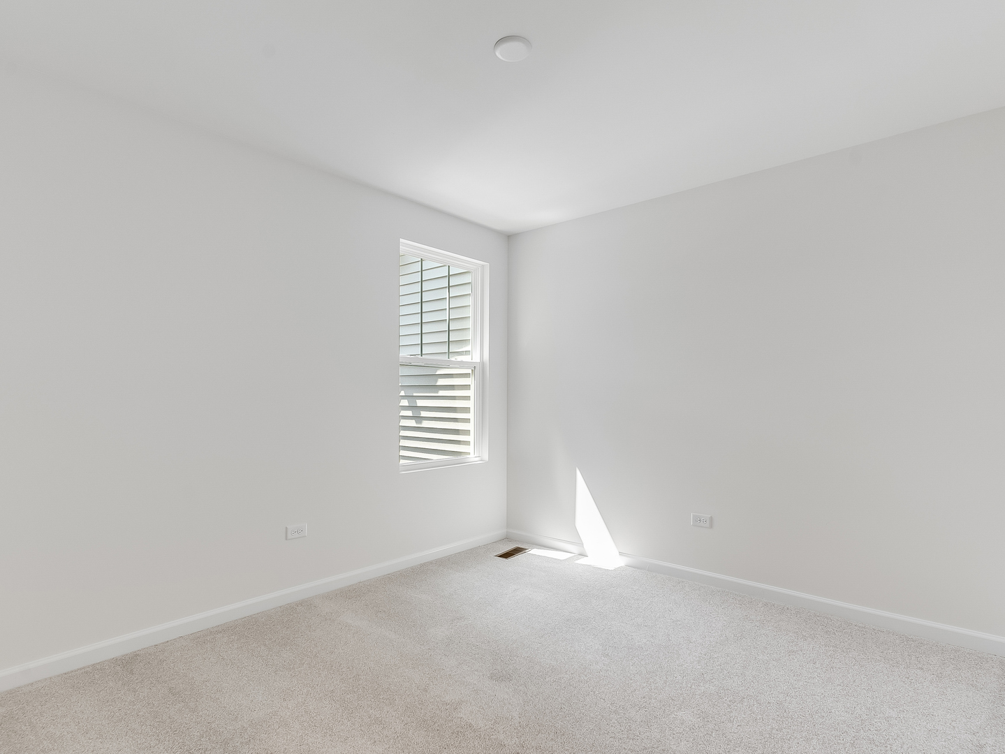 660 Switchgrass Way, Unit 58002 Bolingbrook, IL 60490 - Photo 19 of 24 a view of empty room with a window