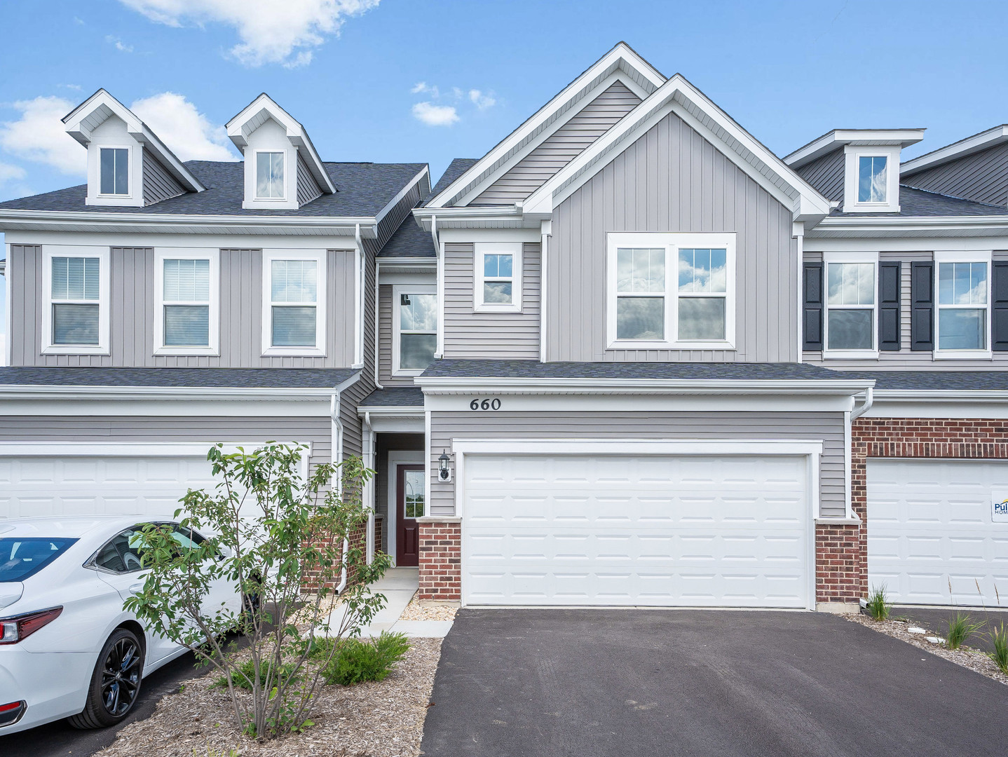 660 Switchgrass Way, Unit 58002 Bolingbrook, IL 60490 - Photo 2 of 24 a front view of a house