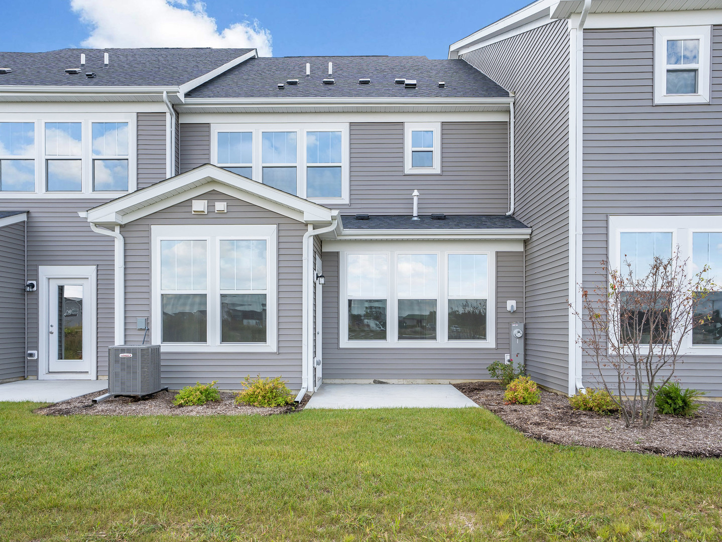 660 Switchgrass Way, Unit 58002 Bolingbrook, IL 60490 - Photo 24 of 24 front view of a house with a yard