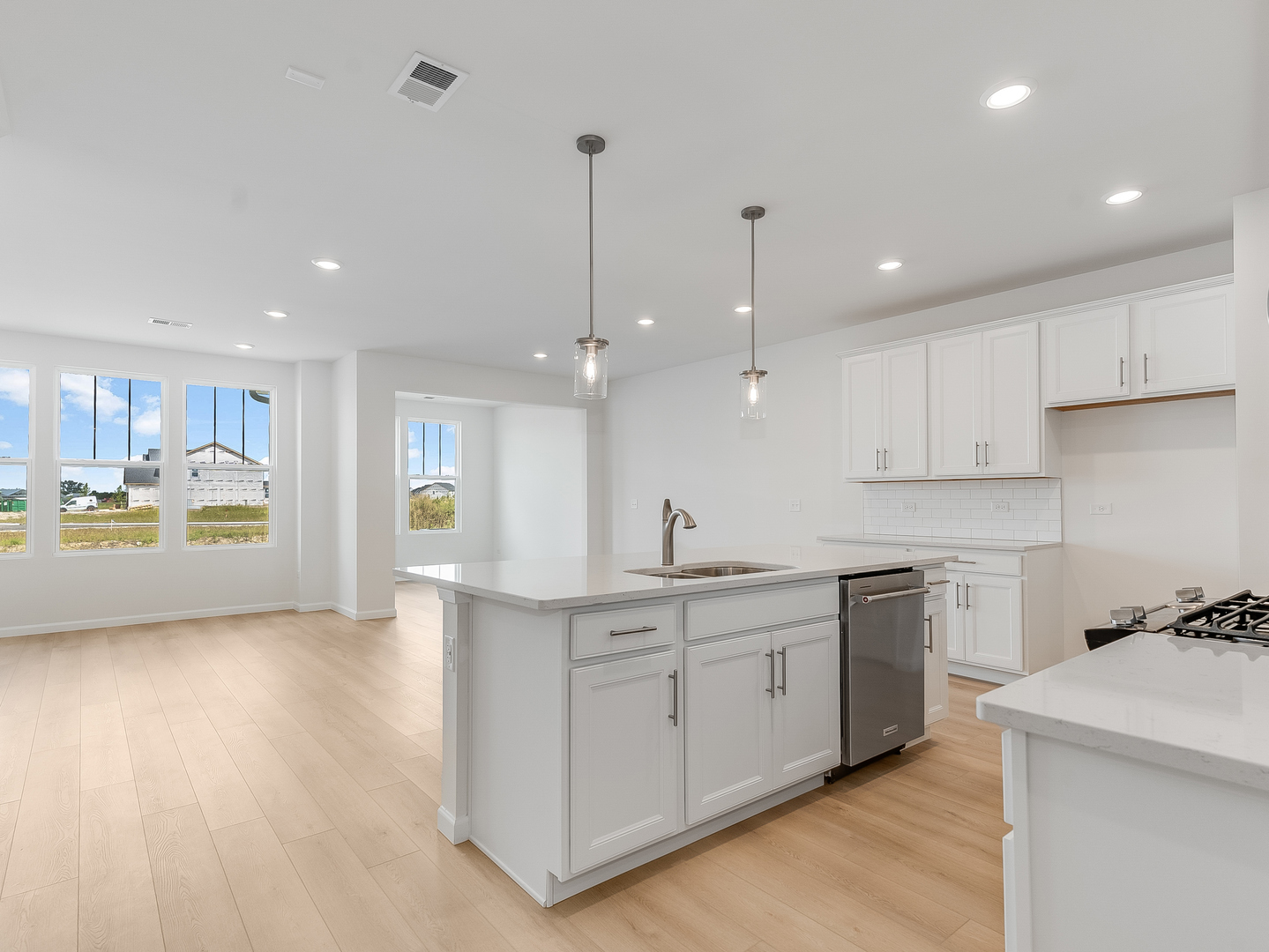 660 Switchgrass Way, Unit 58002 Bolingbrook, IL 60490 - Photo 5 of 24 a kitchen with a sink and cabinets