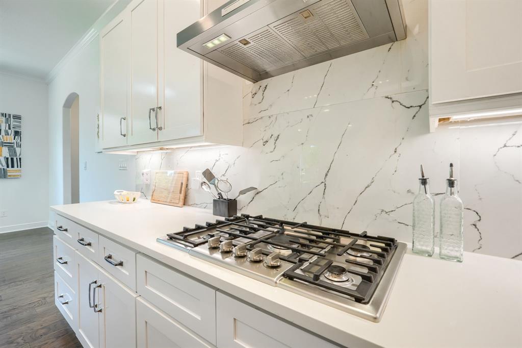 3101 Raphael Court McKinney, TX 75070 - Photo 13 of 40 a stove top oven sitting inside of a kitchen