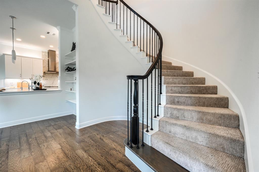 3101 Raphael Court McKinney, TX 75070 - Photo 16 of 40 a view of staircase with white walls and railing