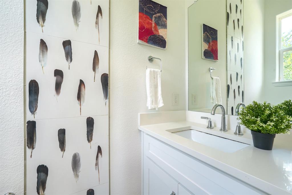 3101 Raphael Court McKinney, TX 75070 - Photo 17 of 40 a bathroom with a sink and mirror