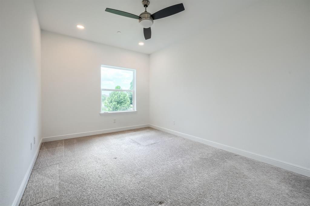 3101 Raphael Court McKinney, TX 75070 - Photo 22 of 40 an empty room with a window and a ceiling fan