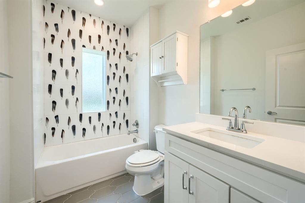 3101 Raphael Court McKinney, TX 75070 - Photo 25 of 40 a bathroom with a sink a toilet and a bathtub