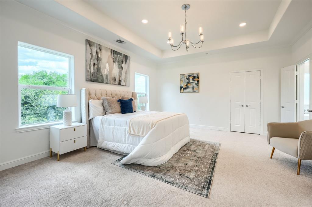 3101 Raphael Court McKinney, TX 75070 - Photo 26 of 40 a bedroom with a large bed and a couch