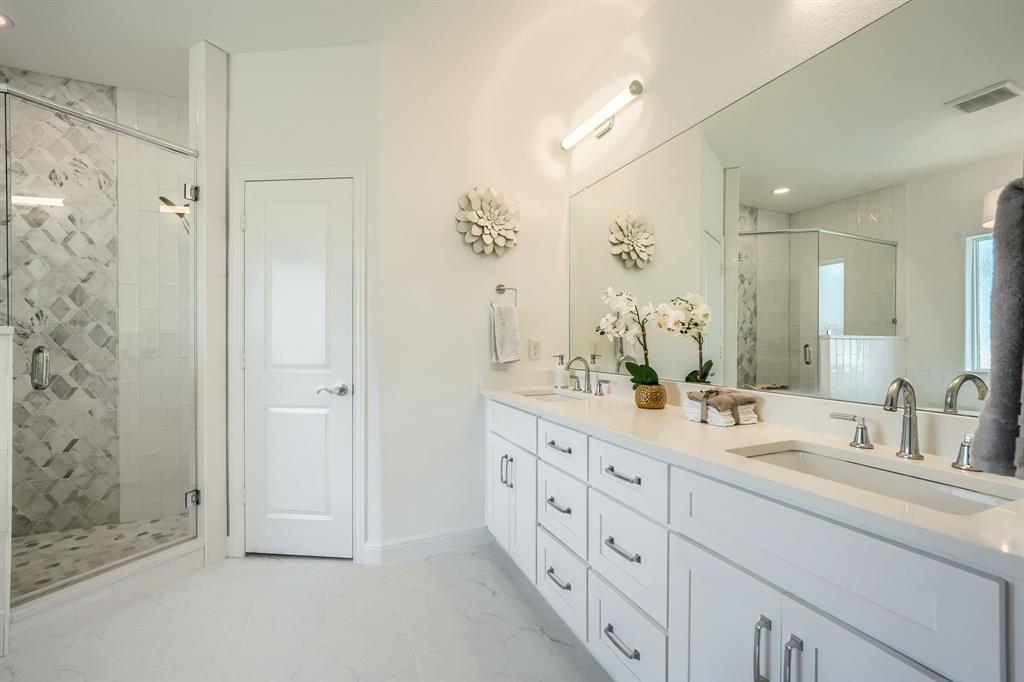 3101 Raphael Court McKinney, TX 75070 - Photo 30 of 40 a bathroom with a double vanity sink mirror and double