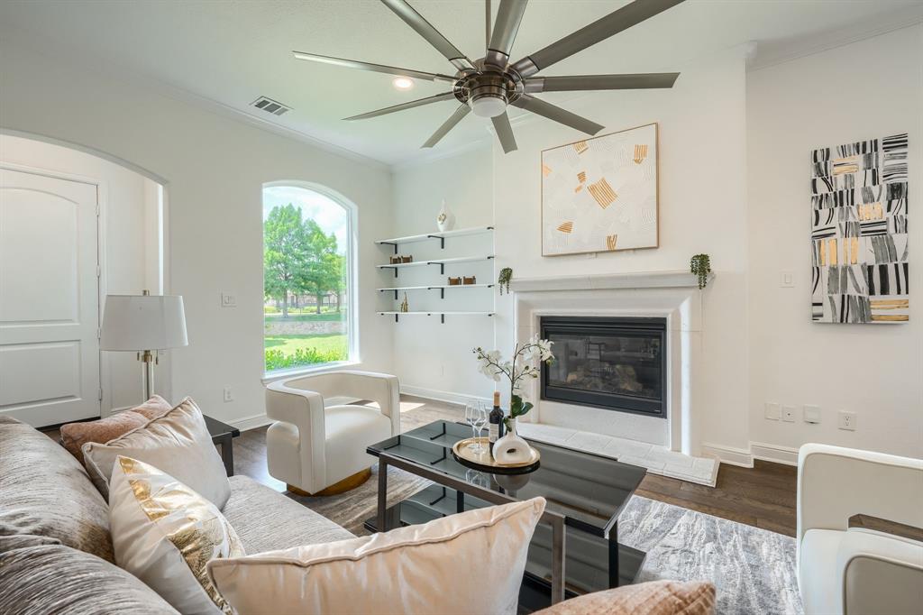 3101 Raphael Court McKinney, TX 75070 - Photo 9 of 40 a living room with furniture and a fireplace