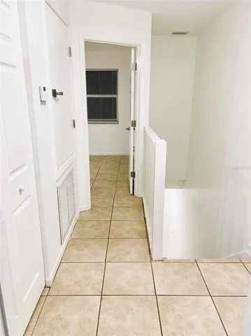 a view of a city with tall trees