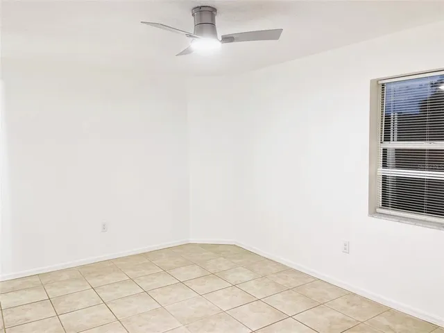 an aerial view of a house with a swimming pool outdoor seating and yard
